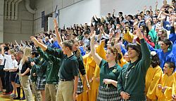 Music, faith and testimonials bring students to their feet at rosary rally