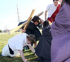 Eighth-grade students perform Living Stations of the Cross