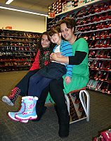 Ladies of Charity grant buys shoes for children in need