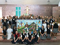 Students' painting of saints presented to parish