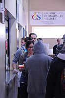 Young adults serve sandwiches, build friendships