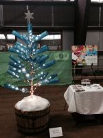 Holy Cross Ministries raises funds for educational programs at Park City Rotary Club Christmas tree festival