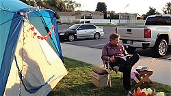 Principal camps out to reward students for reaching goal
