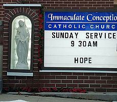 Parish's new sign incorporates Marian statue from Huntsville's now-closed Trappist monastery