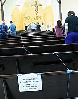 Local Catholics rejoice at once again gathering for Mass, receiving the Eucharist