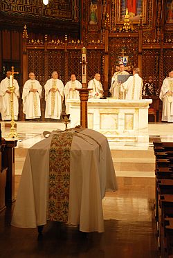 The Catholic Funeral Rite includes symbols