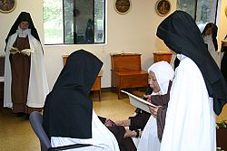 Discalced Carmelite nun professes final vows during veiling ceremony at Holladay monastery